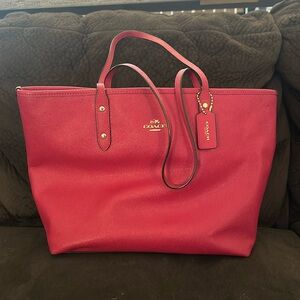 Dark pink Coach purse.